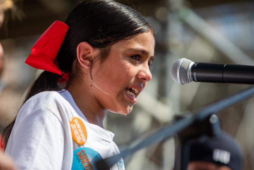 Caitlyn Gonzales, 10, breaks down into tears while telling her story of the events of May 24th, explaining her fear after a bullet pierced the wall nearest her and recounting the screams she heard from the classroom across the hall, while at a rally calling for greater gun control legislation at the state Capitol in Austin on Gun Safety Advocacy Day on Feb. 28, 2023. Gonzales was not tall enough to reach the microphone on the podium, so she stood atop a milk crate.