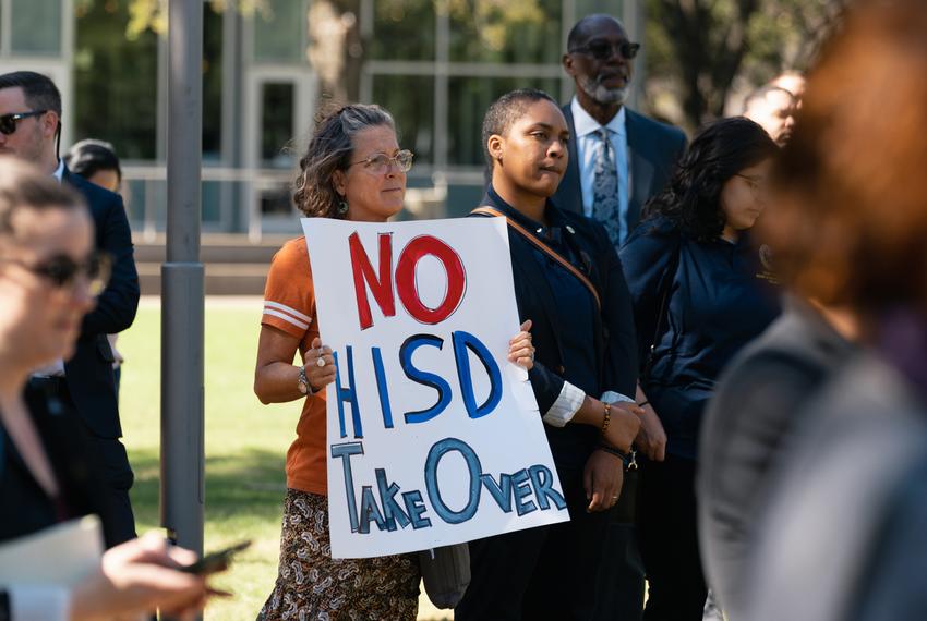 Laurel Hays holds a poster against the Texas Education Agency (TEA) takeover of Houston Independent School District (HISD) during a press conference regarding HISD's imminent state takeover in Houston, on Friday, March 3, 2023.