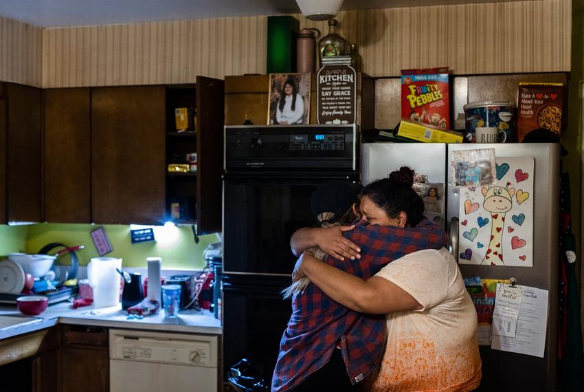 Jessica Treviño hugs Ida Velasquez, her cousin-in-law, after they helped her daughter Illiana calm down from a panic attack on the ten month anniversary of the Robb Elementary school shooting in her home on March 24, 2023. "You have to stay strong," Treviño said to her Velasquez, "If she sees you crying, she will get upset again."