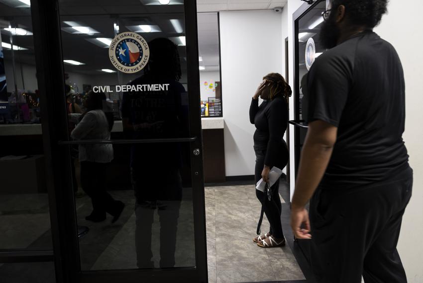 A woman wipes her eyes as she battles an eviction at the Harris County Justice of the Peace (Pct. 5, Place 1) on Tuesday, April 4, 2023, in Houston, TX.            