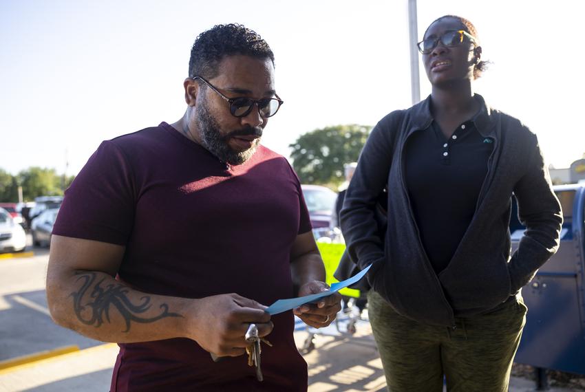 Tenants Anthony McDonald and his wife Stalica Munroe look over the form blue sheet after their eviction hearing on Tuesday, April 11, 2023, in Houston, TX. McDonald and Munroe were seemingly accidentally evicted after agreeing with the complex to pay at the end of the month.
