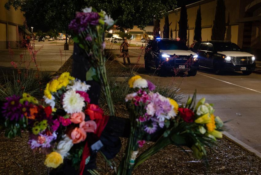 Department of Public Safety officers block the entrance to the Allen Premium Outlets mall nearby a makeshift memorial for the shooting victims, on May 7, 2023.