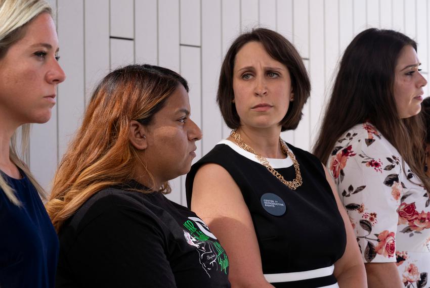 Molly Duane, center right, stands with the women who testified following the first day of testimony for Zurawski v. State of Texas outside the Travis County Civil and Family Courts Facility in Austin on July 19, 2023.