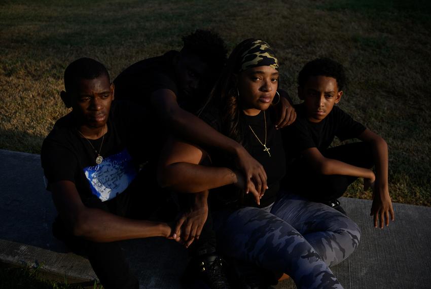 Yosha Hamilton, the mother of 16-year-old Shane Hamilton, who was shot and killed outside of his family’s apartment in January, poses for a portrait with 3 of Shane’s brothers, Lionel Hamilton, 18, Markaven Washington, 15, and Sebashton Bryant, 10, in Baytown, Texas, U.S., on Saturday, August 19, 2023. In 2022, young people, defined as those younger than 25, accounted for 26 percent of firearm deaths across the state.