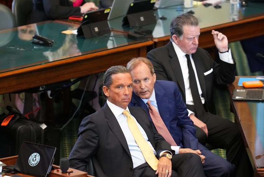Suspended Attorney General Ken Paxton confers with defense attorney Tony Buzbee during the first day of the impeachment trial in the Texas Senate chamber on Sept. 5, 2023.