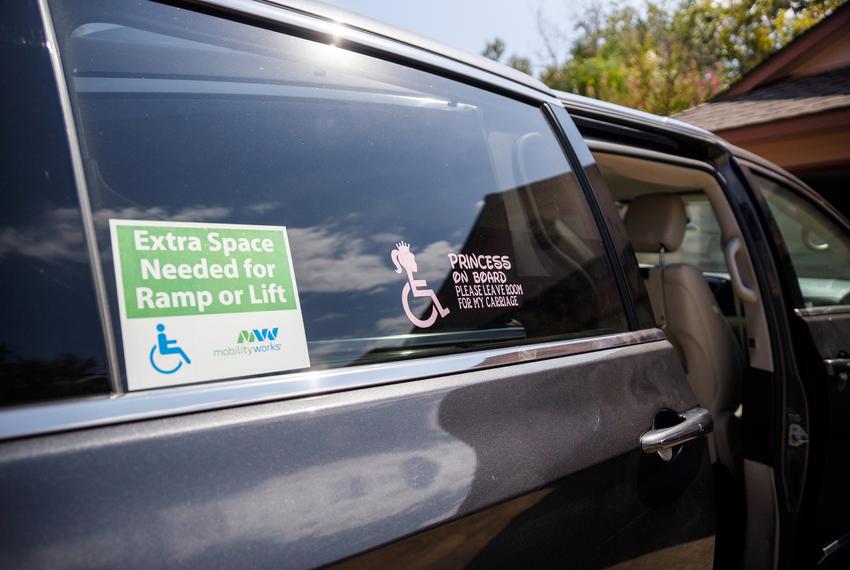 Two window decals are shown on Laurie Sharp's van on Sep. 9, 2023. The stickers reference Logan's wheelchair.