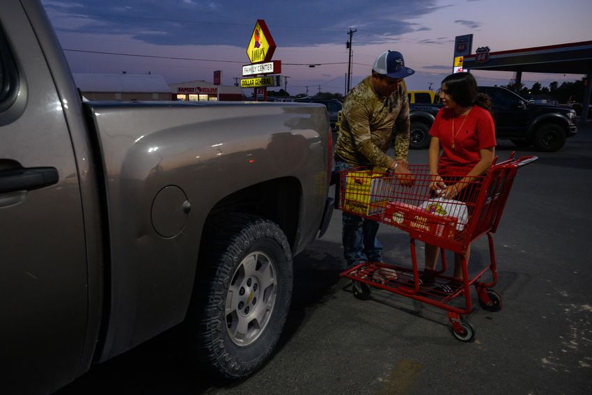 Dagoberto Fierro loads groceries into the bed of his truck with help from Karime Quintana after a trip to one of West Odessa’s only grocery stores, Lowe’s, Thursday, Sept. 14, 2023 in West Odessa.
