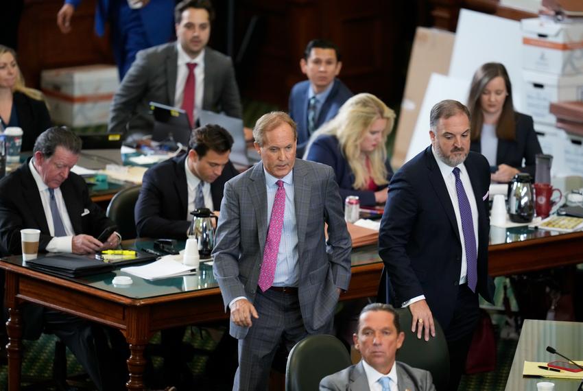 Suspended Attorney General Ken Paxton enters the Senate floor among his attorneys as both sides have rested in Texas Attorney General Ken Paxton's impeachment trial in the Texas Senate on Sept. 15, 2023.