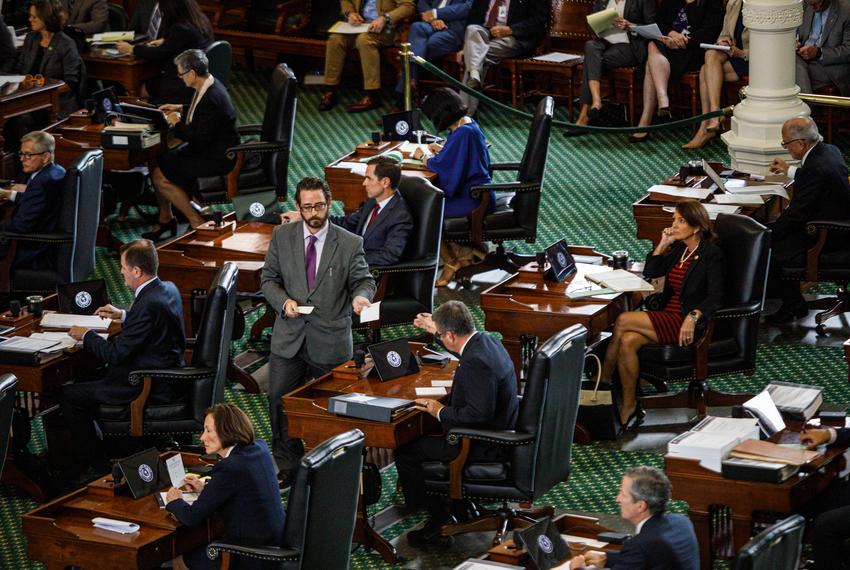 A court bailiff collects votes from senators, skipping Angela Paxton, on the tenth day of suspended Attorney General Ken Paxton’s impeachment trial at the Texas Capitol in Austin on Sept. 16, 2023.