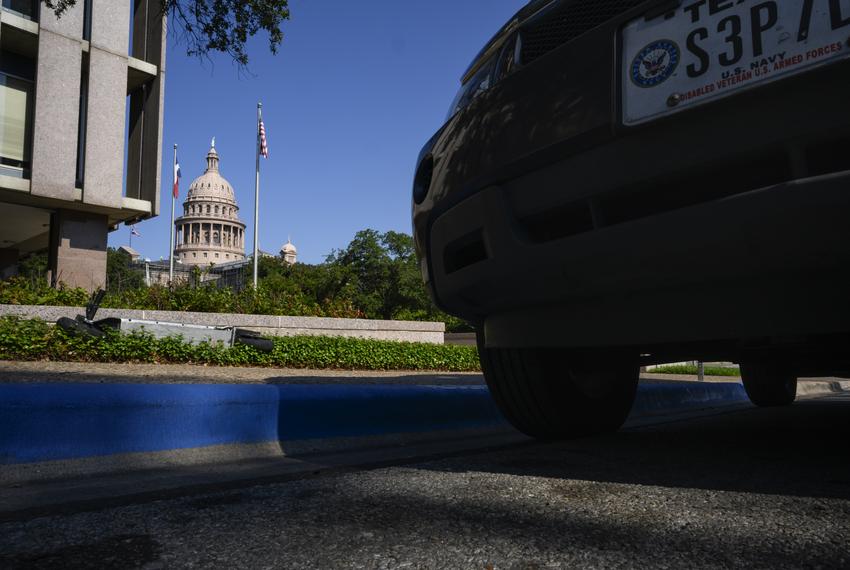 A car with a disabled veteran license plate sits parked in a disabled parking zone outside the Capitol Tuesday, Sept. 19, 2023 in Austin.