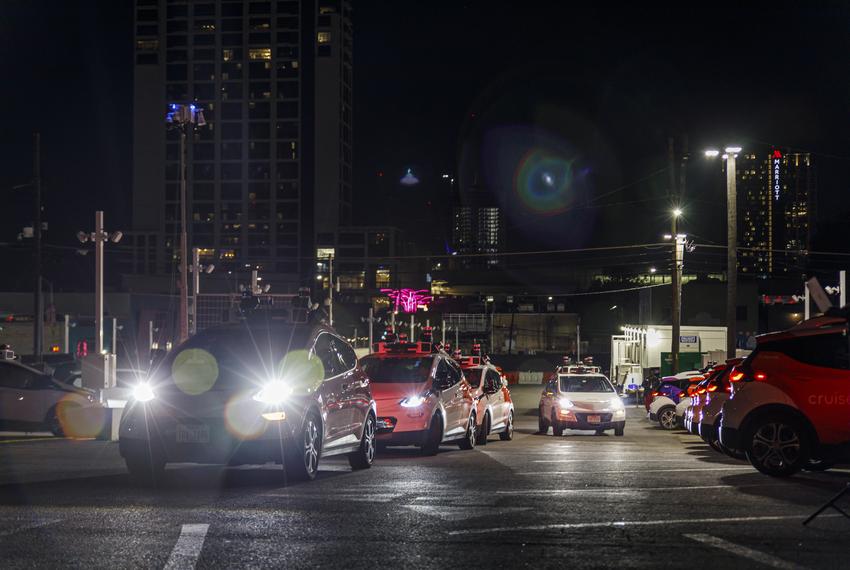 Autonomous Cruise cars line up to leave the Cruise Depot in downtown Austin on Sept. 26, 2023. Cruise, a San Francisco-based autonomous car company, is one of several autonomous driving companies that test vehicles in Austin.
