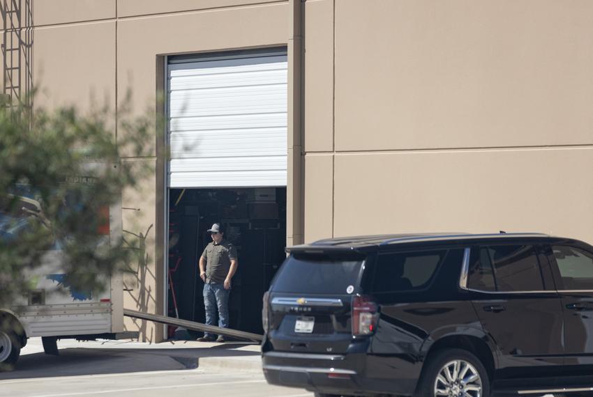 Kyle Rittenhouse is seen helping unload items from a U-Haul at the offices of Pale Horse Strategies in Fort Worth on Oct. 6, 2023.