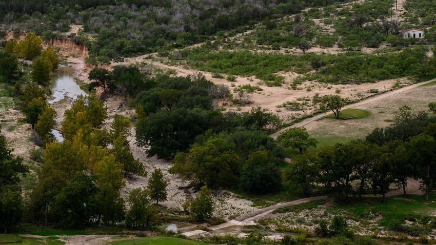 A golf course borders Cedar Creek, a tributary of the South Llano River, Tuesday, Oct. 3, 2023, in Junction.