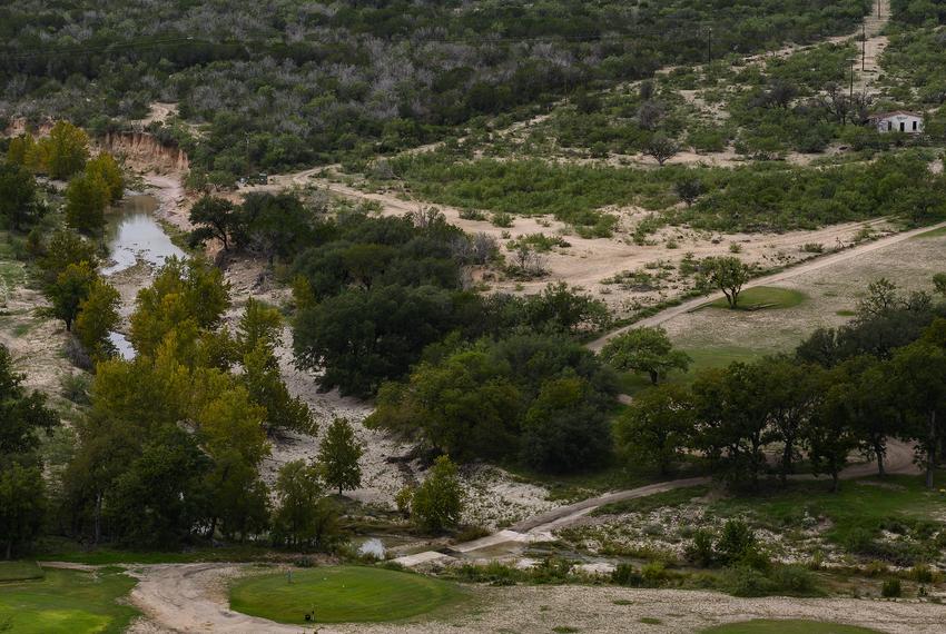 A golf course borders Cedar Creek, a tributary of the South Llano River, Tuesday, Oct. 3, 2023, in Junction.