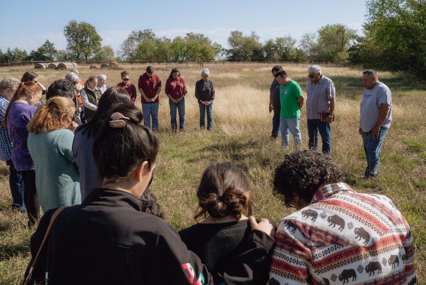 People, including tribe members, gather in a circle during a blessing ceremony for the three herds of bison gifted to Theda Pogue, affiliated with the Muscogee Creek Nation of Oklahoma, and her family on Saturday, November 4, 2023 at GP Ranch in Sulphur Springs, Texas.