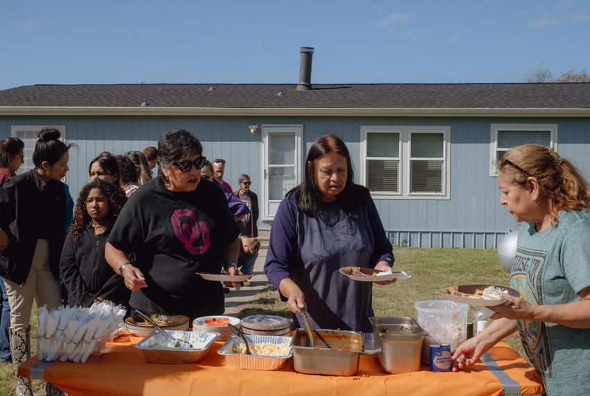 People, including tribe members, line up for a meal following a blessing ceremony for the three herds of bison gifted to Theda Pogue, affiliated with the Muscogee Creek Nation of Oklahoma, and her family on Saturday, November 4, 2023 at GP Ranch in Sulphur Springs, Texas. The meal included three cuts of bison meat prepared by Curtis Fulgham, 43, chef at Social Lounge.