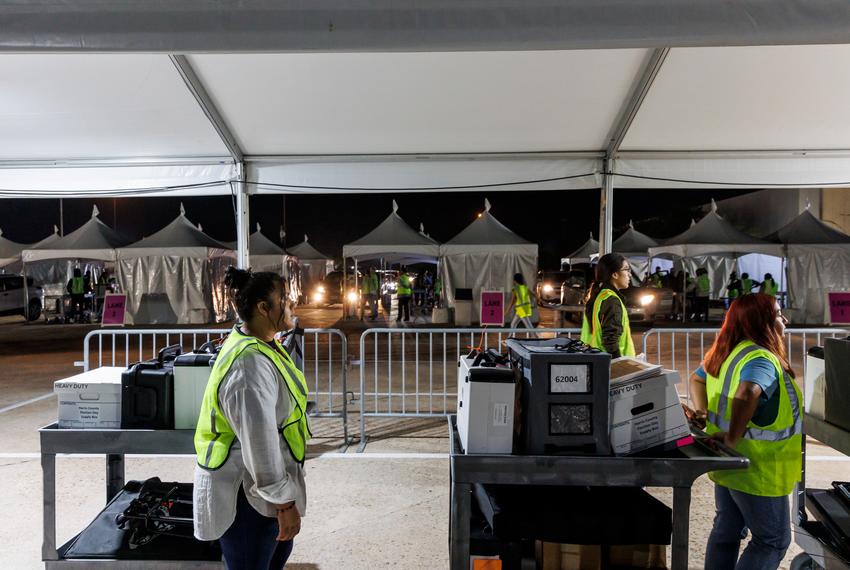 Ballots and scanning machines arrive at central counting after polls close in Houston, Tuesday Nov 8, 2022. (Michael Stravato for the Texas Tribune)