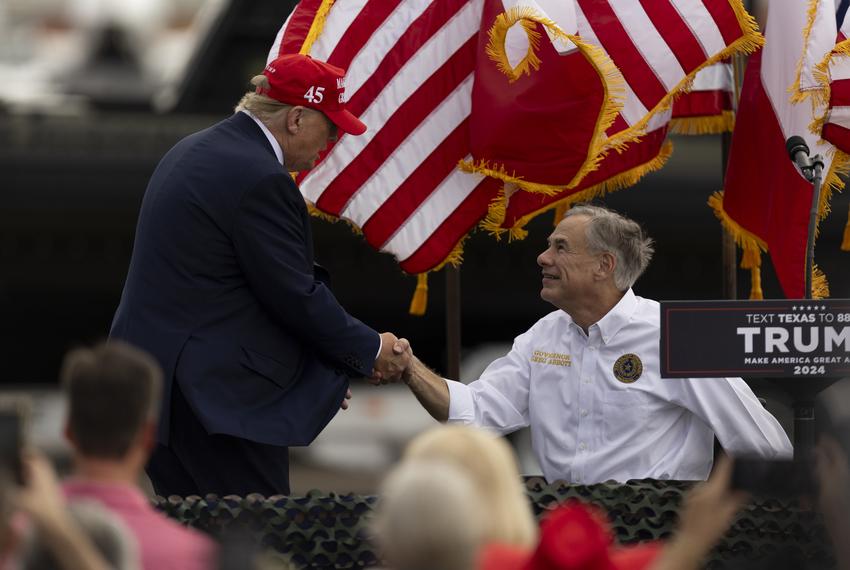 Former President Donald Trump greets and shakes hands with Gov. Greg Abbott at the South Texas International Airport in Edinburg, on Nov. 19, 2023, after the governor announced his endorsement of President Trump. “We need Donald J. Trump back as our president of the United States of America,” the governor said.