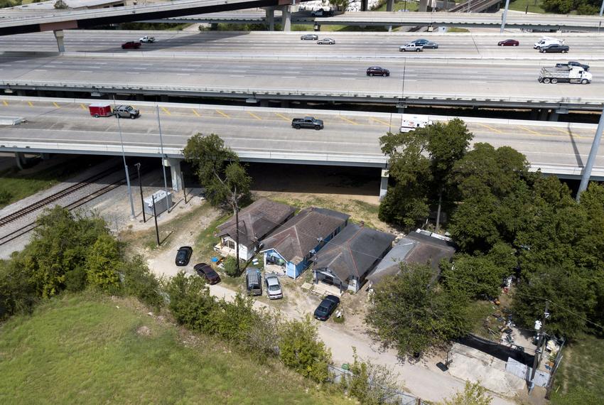 An aerial view of four houses next to I-45 near downtown Houston on Sept. 16, 2019. 