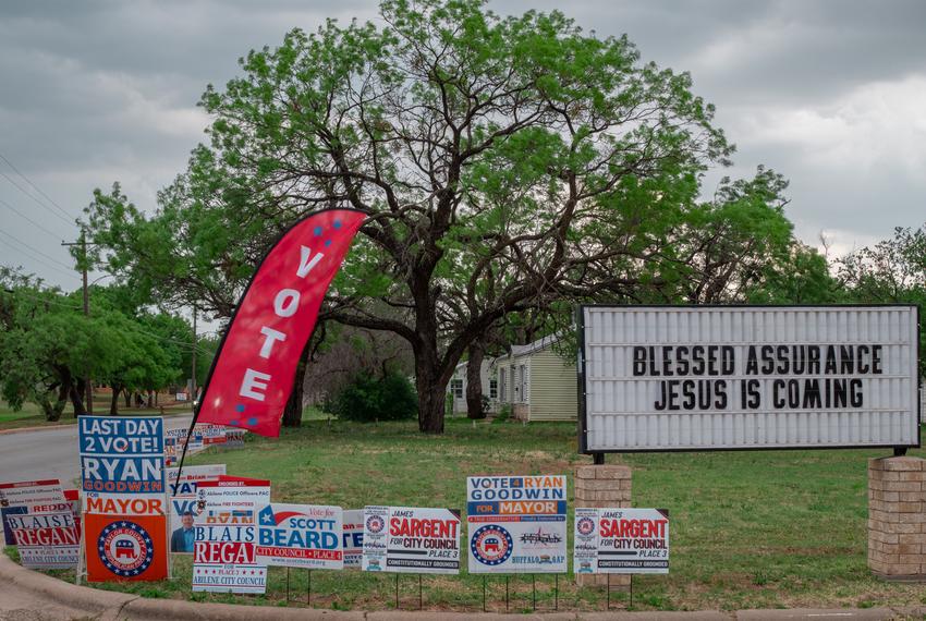 Campign signs outside of the 11th & Willis  St. Church of Christ in Abiele, Texas, on May 6.