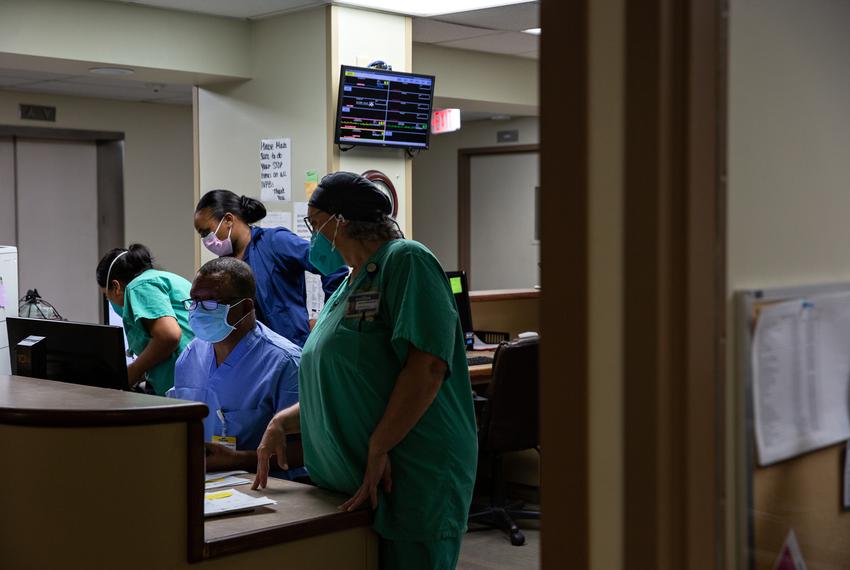 Healthcare workers work in the COVID-19 care unit of the Titus Regional Medical Center in Mount Pleasant on Aug. 19, 2021.