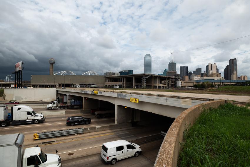 Traffic on Interstate 30 passes near an area land that would have been used as pedestrian bridges leading to a bullet train terminus near downtown Dallas, on Thursday, Aug. 25, 2022. The entities in charge of a bullet train connection between Houston and DFW have faded despite Texas courts approving eminent domain to accomplish the massive project.