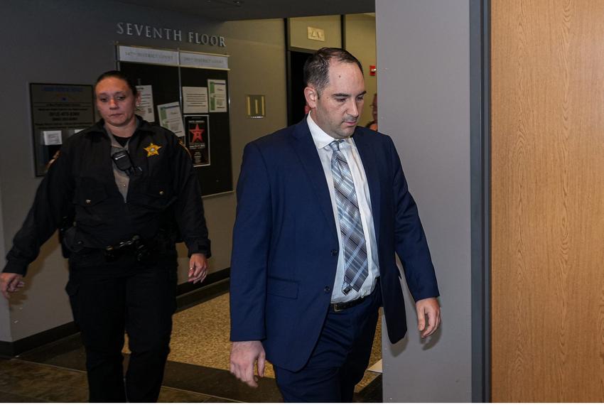 Daniel Perry is escorted to the 147th District Courtroom at the Travis County Blackwell Thurman Criminal Justice Complex in Austin on March 23, 2023.