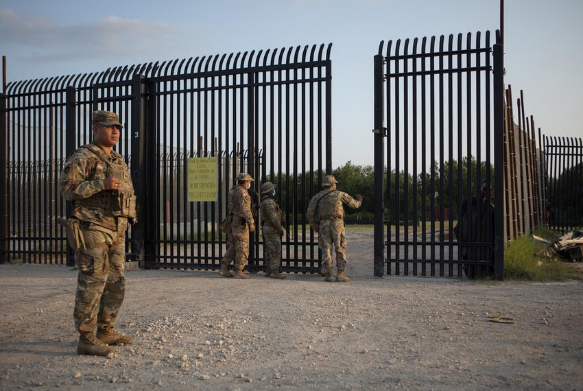 National Guard soldiers stand guard near the U.S. and Mexico border in Del Rio on July 24, 2021.