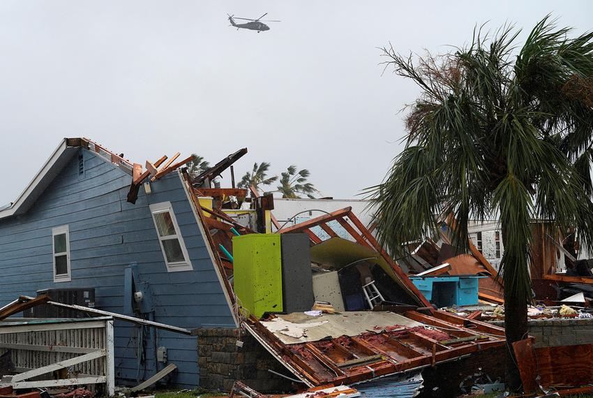 A military helicopter flies over a destroyed house after Hurricane Harvey struck in Rockport, Texas, August 26, 2017.
