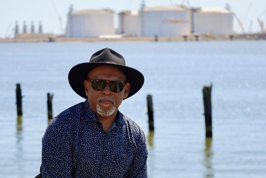 John Beard Jr., the founder and executive director of the Port Arthur Community Action Network, stands in front of the ExxonMobil and QatarEnergy’s Golden Pass LNG facility, just south of Port Arthur, Texas. Beard is a retired refinery worker who first challenged the Port Arthur LNG emissions permit.