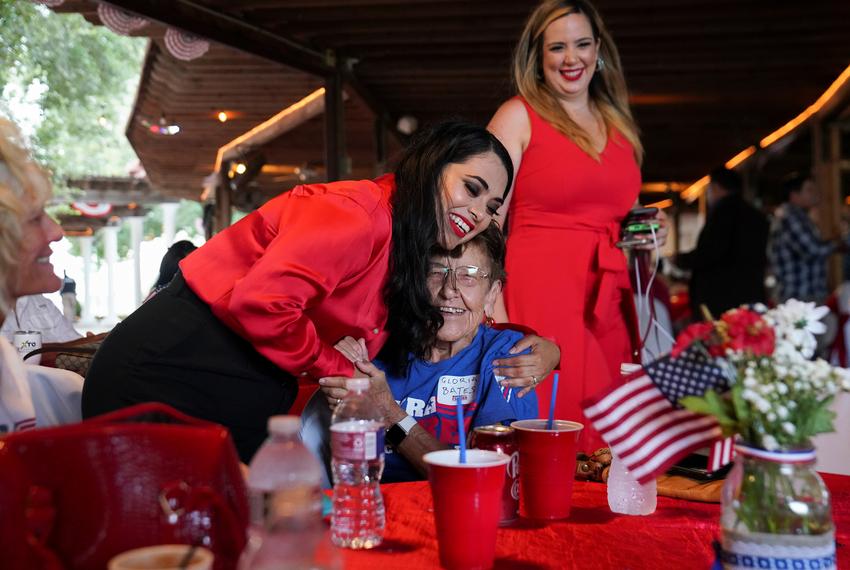 Republican Mayra Flores is greeted by a woman during her primary night watch party in San Benito, on June 14, 2022.