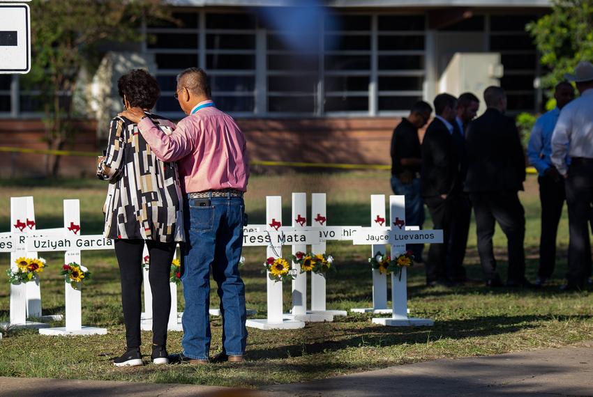 Mourners in front of a memorial at Robb Elementary School on Thursday, May 26, 2022.