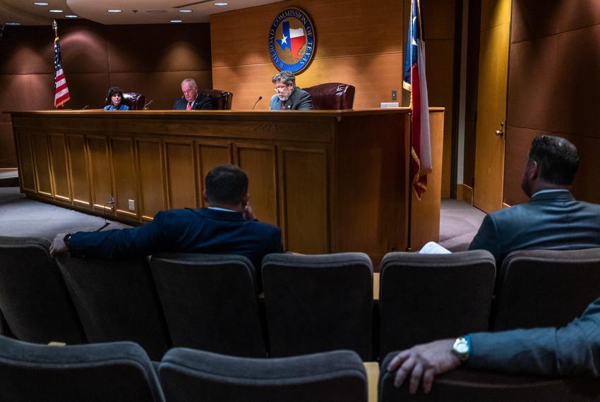 Christi Craddick, Commissioner of the Texas Railroad Commission, Chairman Wayne Christian, and Commissioner Jim Wright listen during an RRC hearing in the William B. Travis Building in Austin on Nov. 30, 2021.