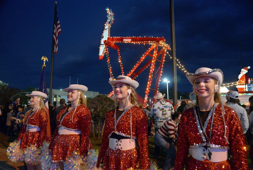The Huntington High School High Steppers drill team stands at attention at the Rudolph the Red Nosed Pumping Unit lighting ceremony in downtown Lufkin on Friday, Dec. 1, 2023.