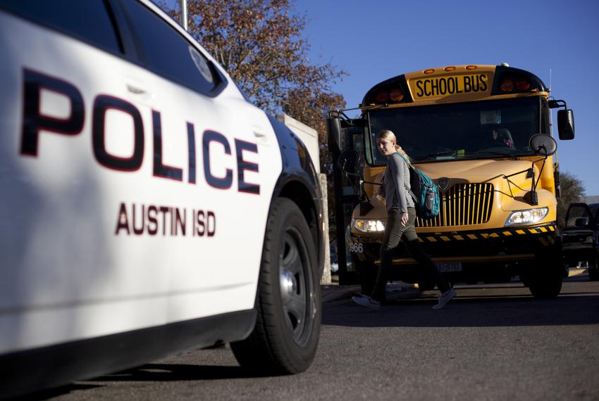 An Austin Independent School District police vehicle sits outside of McCallum High School in Austin, on Dec. 28, 2012.