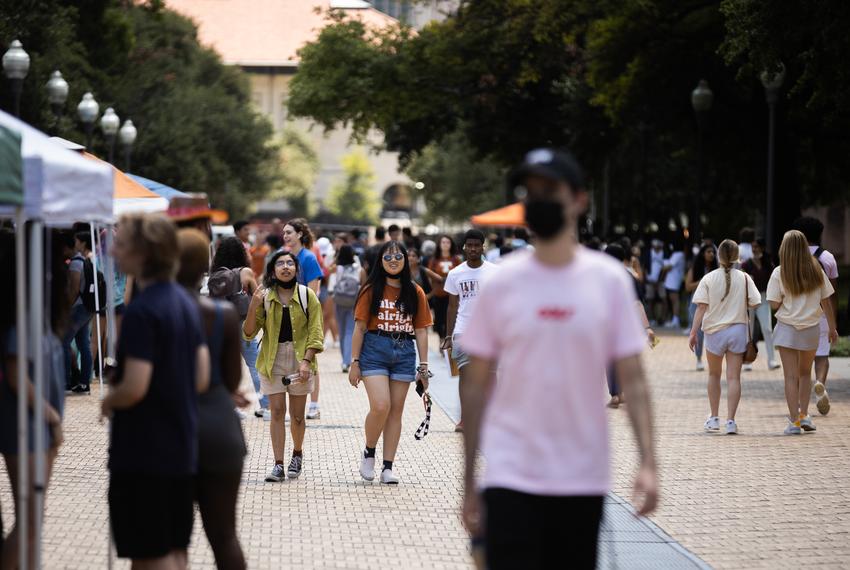 Students walk down Speedway Mall at the University of Texas at Austin on Aug. 25, 2021.