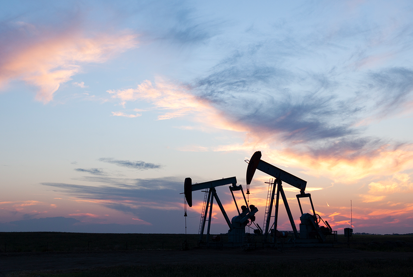 Oil pumps during sunset.